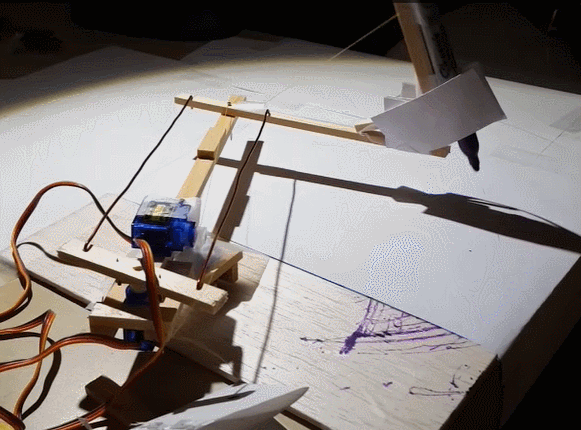 A servo lifts and drops the sharpie on the arm.