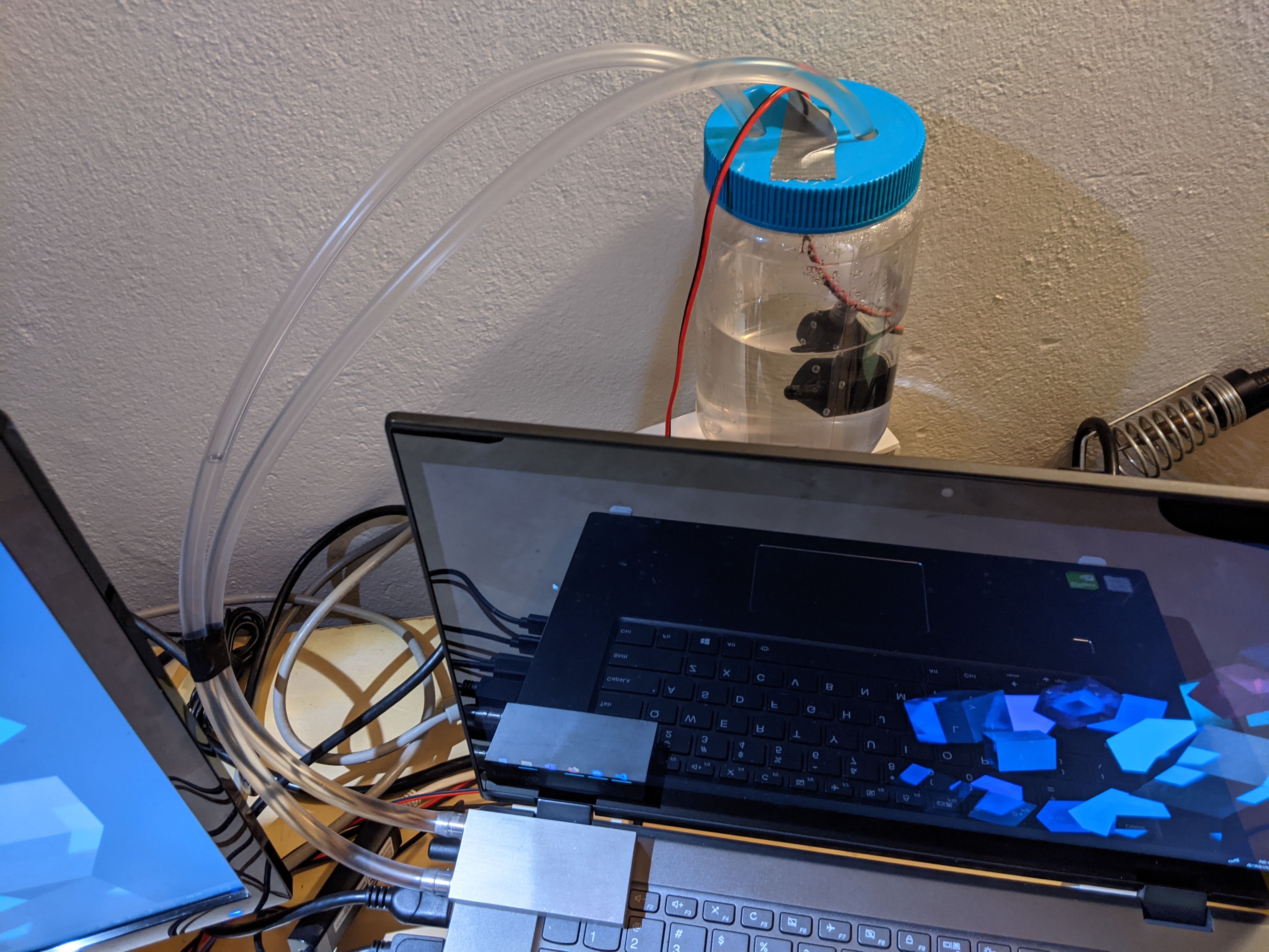 Image of my laptop and its cooling setup.